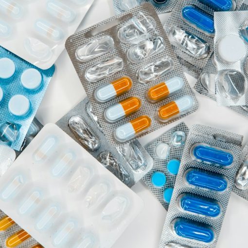 A pile of pills sitting next to each other on top of a table, illustrating fixing virtualization problems