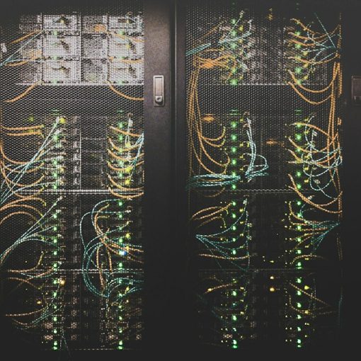 Network cables in a server rack, illustrating virtualization versus a private cloud