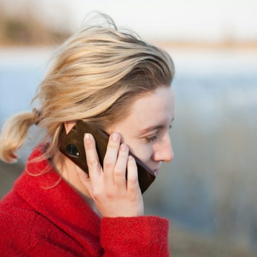 Woman taking a phone call, illustrating VoIP growth