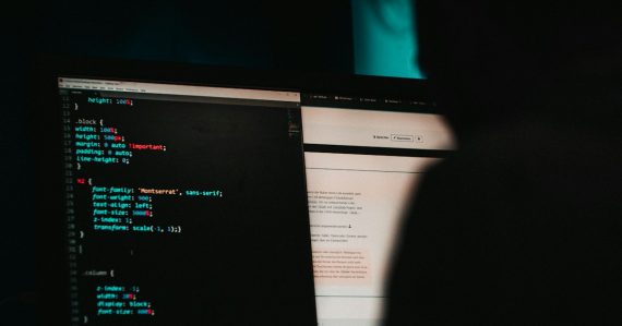 Flat screen computer monitor displaying white and black screen, illustrating VoIP hacker attacks visualized