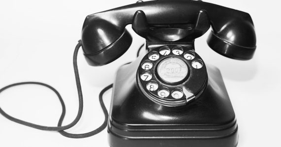 Photo of black rotary telephone, illustrating VoIP phreaking