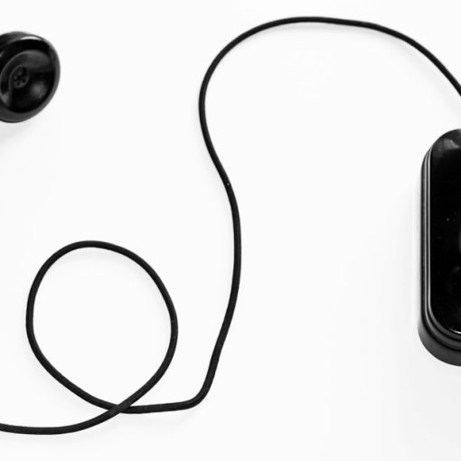 Photo of black rotary phone against white background, illustrating rising VoIP hacking