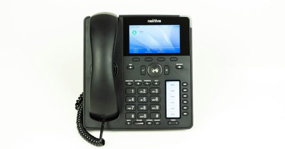 Black and gray ip desk phone, illustrating SMB demand for VoIP