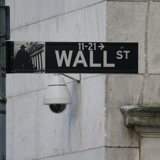 A street sign on the corner of Wall Street, illustrating Wall Street's cautious look at the cloud