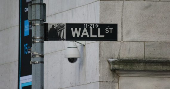 A street sign on the corner of Wall Street, illustrating Wall Street's cautious look at the cloud