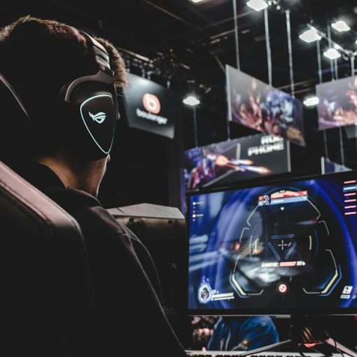 Person sitting on gaming chair while playing video game, illustrating Zynga's cloud computing advantage